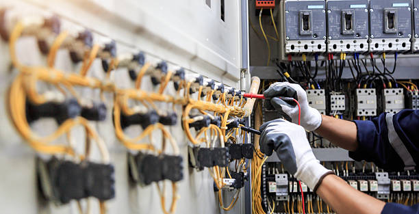 Professional Electrician technician working in Norcross, GA